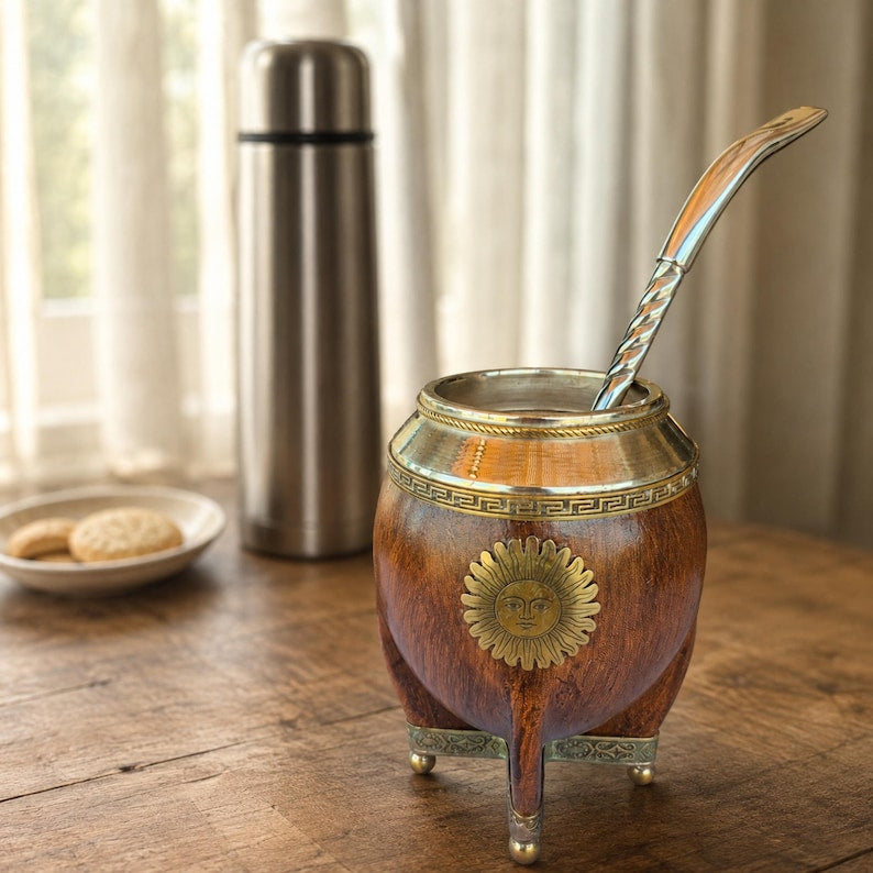 Mate gourd with brass sun emblem and metal legs